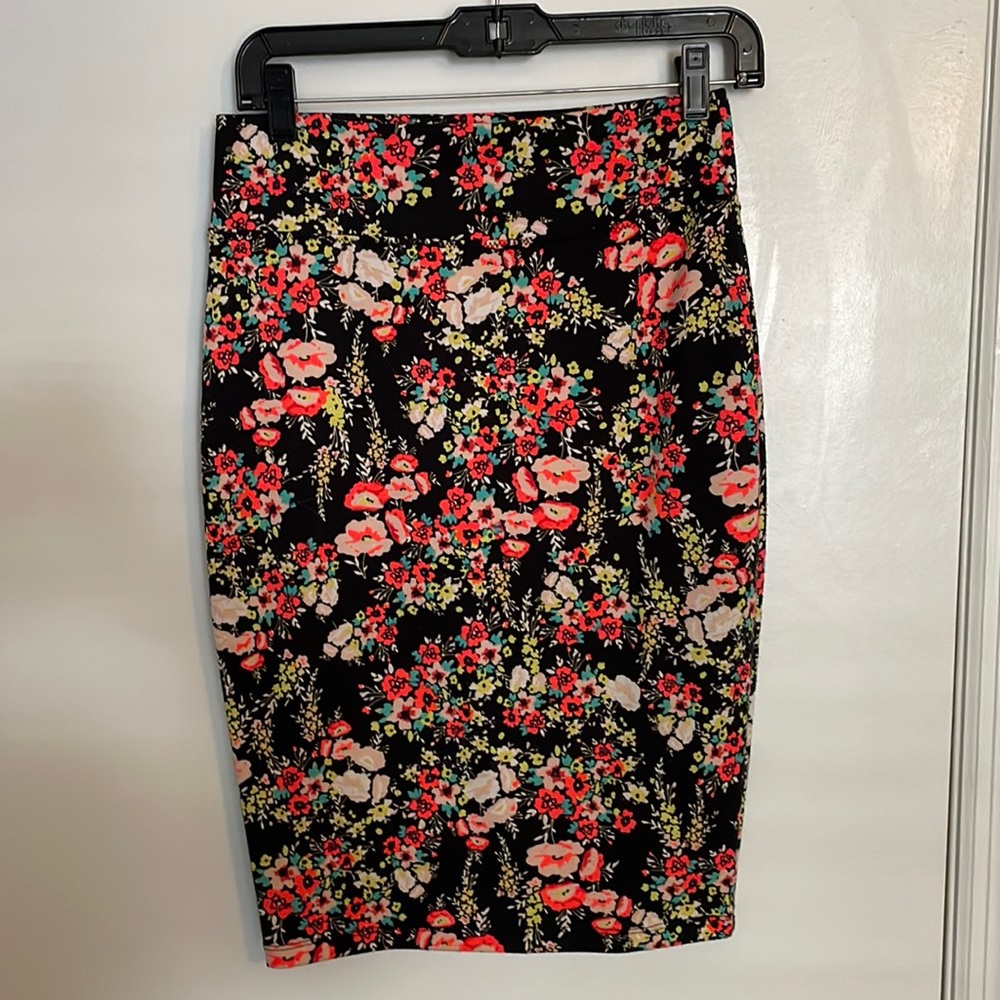 Black body con midi skirt with neon colored flowers.